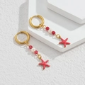 Gold hoop earrings with red beads, white pearls, and red starfish pendants in sea style - Red Sea Star Style