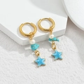Gold ocean earrings featuring blue enamel starfish, white pearl, and turquoise beads - Blue Star