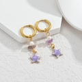 Gold ocean earrings featuring white pearls and purple starfish charms on a white stone base - Purple Star