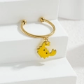 Detail view of gold hoop earrings featuring cute yellow monster charms with drip oil craft - Crab Style (M-R859) / Yellow
