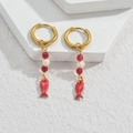 Marine style golden hoop earrings with red beads and a small red fish pendant charm - Red Fish Style