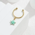 Golden stainless steel open ring featuring a textured light green starfish pendant - Starfish Style (M-R864) / Green
