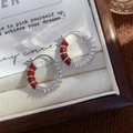 Detail of silver hoop earrings with red enamel coating and pave-set cubic zirconia stones - Silver Style (A0625C)