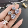 Detail of silver oval earrings with double-linked pink cubic zirconia in prong setting - 24K / Silver (A0610A)
