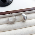 Minimalist silver C-shape stud earrings with matte brushed finish and polished inner surface - Silver