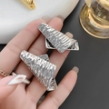 Irregular silver-colored stud earrings with textured wrinkle surface and abstract geometry - Silver