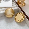 Detailed macro view of large polished gold dome earrings with intricate filigree back design - Gold (A0234A)