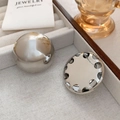 Detailed close-up of high-polish silver dome earrings on a minimalist jewelry tray - Silver (A0234A)