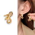 Gold snake stud earrings with pavé diamonds and black stone eyes on model - Gold (A0239B)