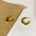 Detailed view of chunky gold hollow hoop earrings with a polished mirror finish surface - Small Style / Gold