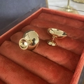 Macro detail of high-polish gold dome earrings displayed in a luxury red velvet box - Copper Plated 18K Real Gold / Gold (A0319B)