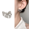 Silver bow stud earrings with sparkling zircons shown on white background and model - Silver with Zirconia (A1104-04C)