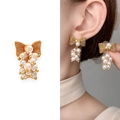 Orecchini a fiocco dorato con grappolo di perle pendenti per un look elegante - Oro