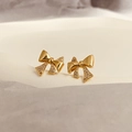 Detail of bow earrings featuring micro-pave cubic zirconia and polished gold plating - Gold (A0638C)
