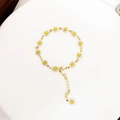Detailed close-up of 14K gold-plated daisy bracelet with white enamel petals and lobster clasp - Daisy Bracelet (A0268A-1)
