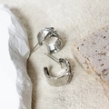 Macro detail of silver wide C-shape stud earrings with shimmering side zircon inlay - Silver (A0831A)