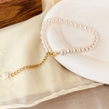 Elegante witte parelarmband met gouden karabijnsluiting en verstelbare metalen ketting - 8mm parel armband / Wit