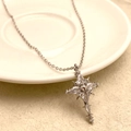 Exquisite silver cross necklace with shimmering cubic zirconia in starburst design - Silver Necklace (A0340B)
