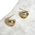 Detail of 18K gold-plated double C-shaped stud earrings with polished mirror finish - Gold