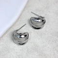 Macro detail of silver double C hollow earrings with a high-polish metallic finish - Silver