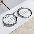 Close-up of silver-tone circular hoop earrings with fine white zircon pavé setting - Silver