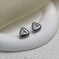 Macro detail of silver geometric triangle mesh earrings with zircon on a white podium - Silver (A0435A)