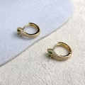 Close-up of gold snake hoop earrings with micro-set zircons and green gemstone eyes - Leopard Head Style (A0205C) / Gold