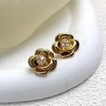 Macro detail of 18K gold plated camellia stud earrings with sparkling 5A zircon center - Gold