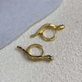 Detailed close-up of gold snake hoop earrings with green eyes and white zircon stones - Gold (A0401C金色)