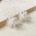 Silver snowflake firework ear clips with zircon inlay on a beige stone surface - Spiral Clip-on Style (A0531A) / Bright Silver (A0531A)