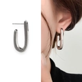Minimalist silver U-shaped earrings with beaded edge texture for women on model - Silver