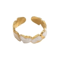 Close-up of golden open heart ring with cream enamel inlay and irregular wing design - Heart Patchwork Enamel Style (A1901-04B)