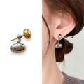 Two-tone minimalist gold bean earrings with silver pebble pendants on a female model - Silver Drop Gold Stud (A0110C)