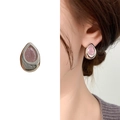 Elegant silver teardrop earrings with pink stones shown in product view and on model - Silver Pink Zircon