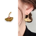 Ginkgo leaf earrings in gold finish featuring a square pink gemstone and leaf textures - Gold Yellow Zircon