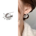 Elegant silver U-shape horseshoe stud earrings with crystals on a model and white background - Silver