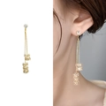 Elegant gold drop earrings featuring tassel chains and sparkling crystal cylinder charms - Gold
