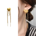 Golden heart earrings featuring long bead chain tassels with a brushed metal finish - Gold