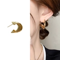Golden irregular wave stud earrings with textured finish and Mobius fold design - Gold
