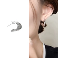 Silver irregular wave Mobius stud earrings shown on model and white background - Bright Silver