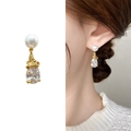 Elegant gold drop earrings featuring a round white pearl and a pear-cut clear zircon - Gold