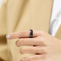 Macro shot of minimalist black faceted ceramic ring with geometric diamond surface texture - US 6 / Black Style 1