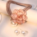 Detailed view of floral pearl necklace set with shimmering crystals and woven cord - Necklace and Earring Set / Pink