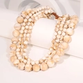 Macro detail of layered beaded necklace with marble texture beads and woven knot closure - No Pendant Multi-layer Necklace