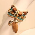 Bohemian multilayered handmade beaded bracelet featuring wood beads and gold charms - Bohemian Multicolor Beaded Style (S-436)