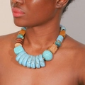 Handmade bohemian necklace with blue turquoise and geometric wooden beads on model - Blue (X-1140)