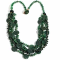 Detailed macro shot of vintage multi-layer necklace with green stone discs and gold beads - Necklace / Green