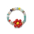 Detail of handmade beaded flower ring with colorful crystals and gold metal accents - Red