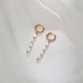 Detail of gold geometric earrings featuring five natural freshwater pearls on silk - Vertical Five Pearl Dangle (DE034-A)