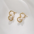 Close-up of gold stainless steel interlocking earrings with white pearls on silk - Infinity Symbol Pearl Style (E038-C) / Gold